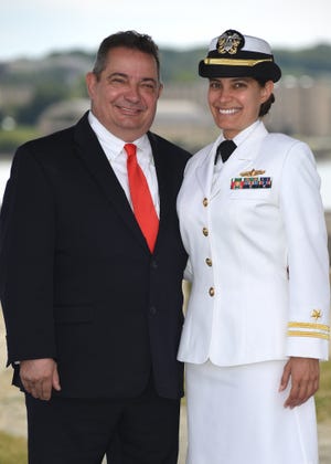 Al Iannocone and daughter Lt. Monica Iannocone, both members of U.S. Naval War College (NWC) graduating class of 2016, pose for a photo at the Bishop's Rock Pinic Gazebo in Newport, Rhode Island.