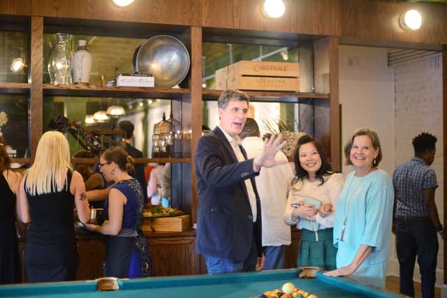 Ben Knight, co-owner of Chef and the Farmer, waves as he greets guests and friends as the restaurant celebrates 'A decade of delicious' on Tuesday at Chef and the Farmer.