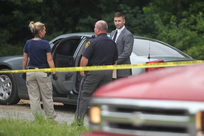 Hannah Covington/The StarCleveland County Sheriff's Office investigators speak to State Bureau of Investigation officers about an officer involved shooting at 1300 E. Stagecoach Trail on Tuesday.