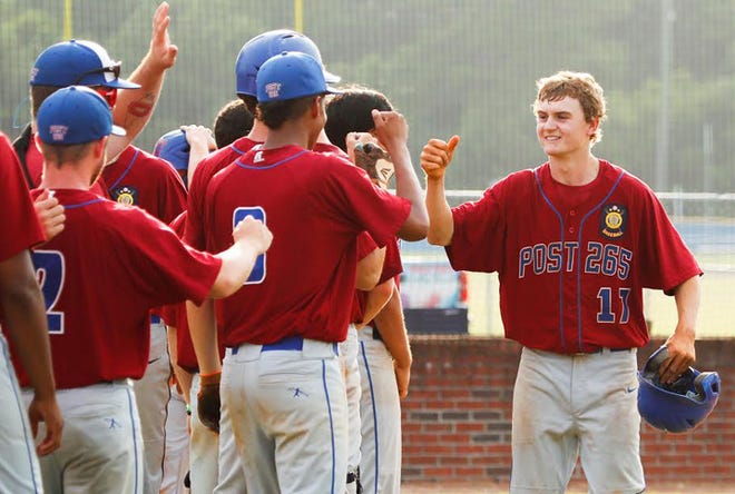 Jacksonville Post 265's Tripp Creech is congratulated after hitting the first of his two home runs in Post 265's 8-3 win at Morehead City in the first game of a doubleheader Wednesday night.