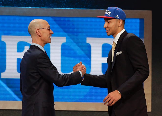 NBA Commissioner Adam Silver, left, greets Ben Simmons after announcing him as the top pick by the Philadelphia 76ers during the NBA Draft on Thursday.