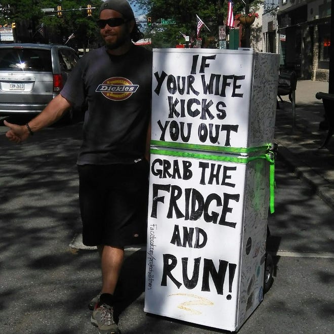 Rob Cope had hitchhiked from San Francisco with this refrigerator to promote his book ìIf Your Wife Kicks You Out, Grab the Fridge and Run! (Photo provided)