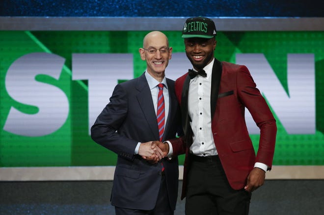 NBA Commissioner Adam Silver, left, poses for a photo with Jaylen Brown after Brown was selected third overall by the Boston Celtics.