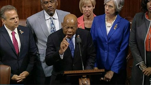 In this frame grab taken from AP video Georgia Rep. John Lewis leads more than 200 Democrats in demanding a vote on measures to expand background checks and block gun purchases by some suspected terrorists in the aftermath of last week's massacre in Orlando, Florida, that killed 49 people in a gay nightclub.
