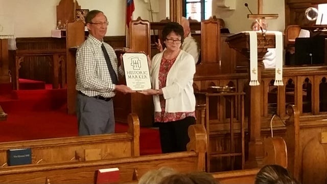 The Tuscarawas County Heritage Home Association presented a historic marker May 22 to its first active church, Trinity Episcopal Church. PHOTO PROVIDED