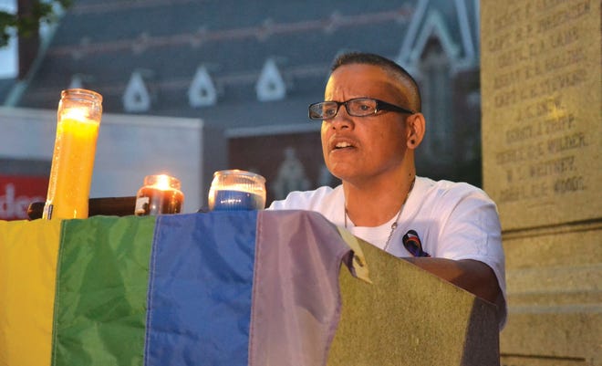 Elijah Hughes, a teacher at Leominster High School, speaks at the vigil.