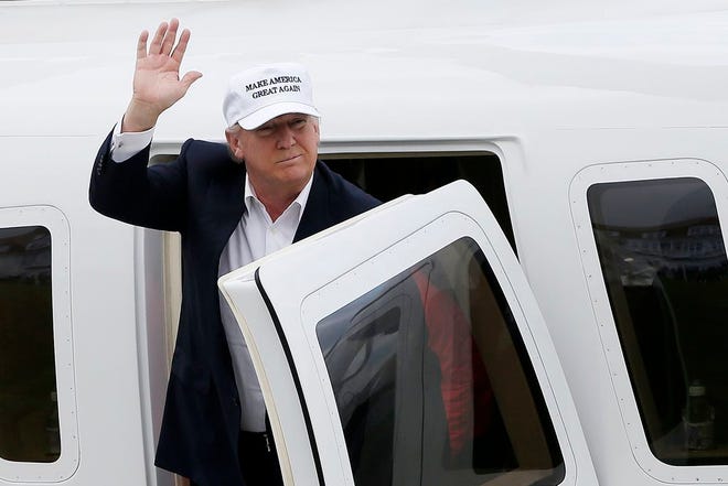 Donald Trump, presumptive Republican presidential nominee, waves as he arrives by helicopter at his Trump Turnberry Resort in Turnberry, U.K, on Friday.