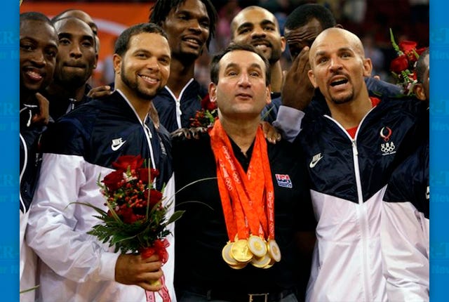 USA's coach Mike Krzyzewski, center, wears his players gold medals as they celebrate after beating Spain 118-107 in the men's gold medal basketball game at the Beijing 2008 Olympics in Beijing, Sunday, Aug. 24, 2008. Flanking Krzyzewski is Deron Williams, left, and Jason Kidd.