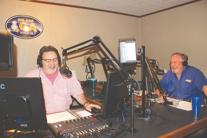 Greg Hoover (left) and Mike Bock share a laugh as the morning team on WRGG.
