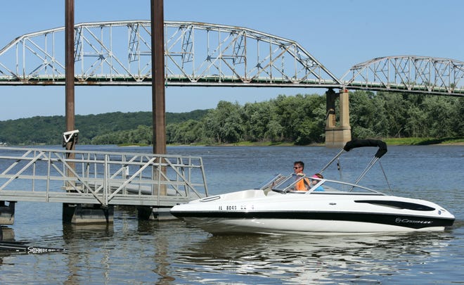 In this June 15, 2016 photo, Darrell and Angie Stafford of Flanagan, Illinois, pull into the public boat ramp along the Illinois River in Henry, Ill., after an afternoon out boating. Thousands of boaters are still active on Illinois waters, but their numbers have declined significantly over the past several years due to the struggling economy.(Chris Yucus/NewsTribune via AP) MANDATORY CREDIT