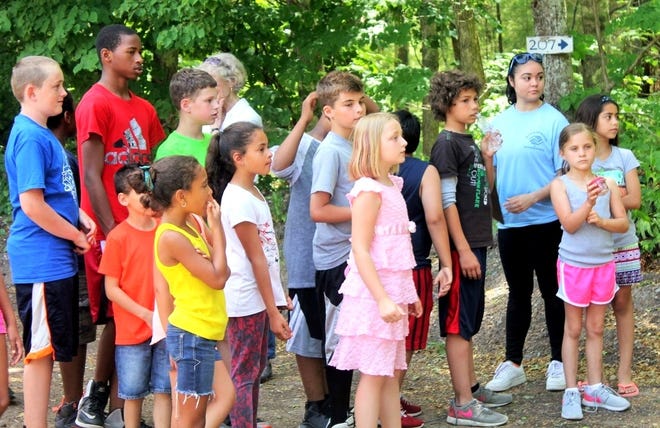 Members of the Wareham Unit of the Boys & Girls Club of New Bedford listen to instructions prior to commencing a hike June 22 at the Great Neck Wildlife Sanctuary.

Wicked Local Photo/Chris Shott