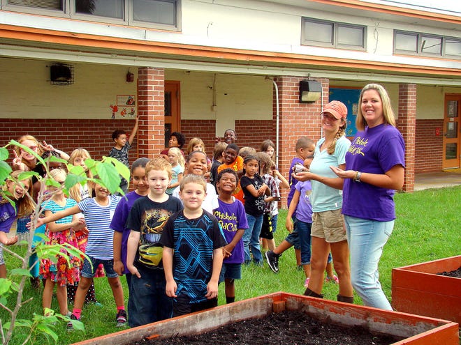 Chisholm Elementary teacher Jennifer Grant, right, and her second-grade class could eventually find themselves in a new building as plans call for their school to be replaced. Photo provided