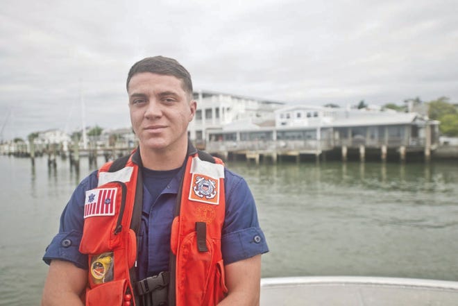 Coast Guard Station Fort Macon Fireman James Sanders Jr., standing outside the station, was recently recognized for leading a group of people to help following a pier collapse earlier this year. U.S. Coast Guard photo