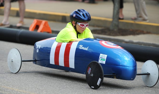 TIMES-REPORTER PAT BURK

Norah Chismar, 11, competes in the Super Stock Division of the 2016 Tuscarawas County Soap Box Derby Sunday in Sugarcreek.