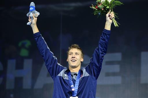 Chase Kalisz celebrates after winning the men's 400-meter individual medley at the U.S. Olympic swimming trials in Omaha, Neb., Sunday, June 26, 2016. (AP Photo/Orlin Wagner)