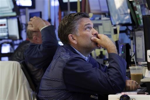 Trader Jeffrey Lucchesi works on the floor of the New York Stock Exchange, Monday, June 27, 2016. Stocks are opening lower on Wall Street following bigger losses in Europe as investors continue to grapple with the fallout of Britain's vote to leave the European Union. (AP Photo/Richard Drew)