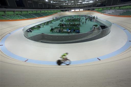 A cyclist rides his bike during a test event at the new velodrome, the last venue of the Rio 2016 Olympic Park to be delivered, in Rio de Janeiro, Brazil, Sunday, June 26, 2016. Rio will become the first South American city to host the Summer Olympics. (AP Photo/Silvia Izquierdo)