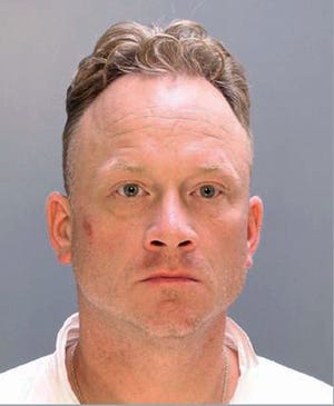 This undated photo provided by the Philadelphia Police Department shows Paul Kuzan. Authorities say Kuzan used a crossbow to fatally shoot his wife of nine days, Pamela Nightlinger, on Sunday, June 26, 2016, at their Philadelphia home, and he has been charged with murder and possessing an instrument of crime. (Philadelphia Police Department via AP)