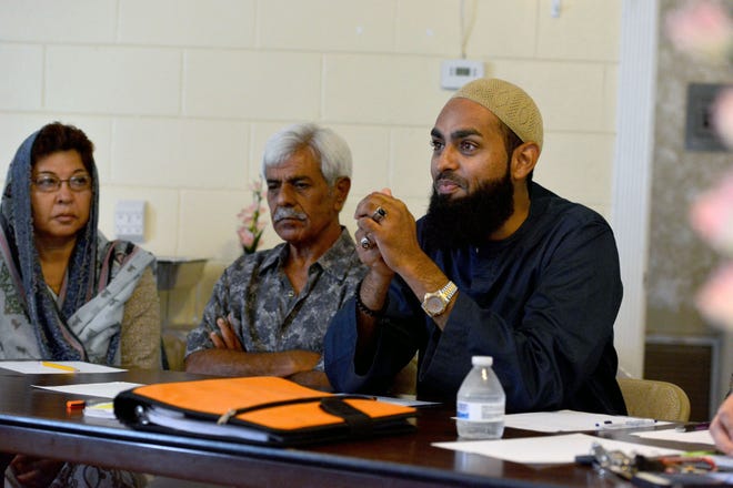 Imam Azhar prays during an interfaith meeting on Monday at the Islamic Society of Lake County in Leesburg. Representatives from an array of faith traditions met to discuss forming a county-wide interfaith organization in the wake of the Pulse nightclub mass shooting as a way to bring the community together.