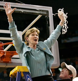 Tennessee women's basketball coach Pat Summitt holds up the net after Tennessee beat Stanford for its eighth national championship in 2008. Summitt, the winningest coach in Division I college basketball history - men or women - died Tuesday. She was 64.