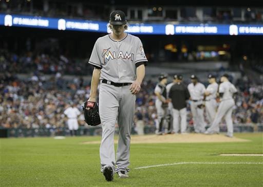 Miami Marlins starting pitcher Adam Conley walks back to the dugout after being relieved during the fifth inning of a baseball game against the Detroit Tigers, Tuesday, June 28, 2016, in Detroit. (AP Photo/Carlos Osorio)