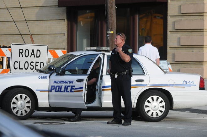 A Wilmington Police Officer supervises security during filming of 'We're the Millers' in downtown Wilmington in 2012. Officers will now be paid more due to a change in the city's fee schedule. StarNews file photo