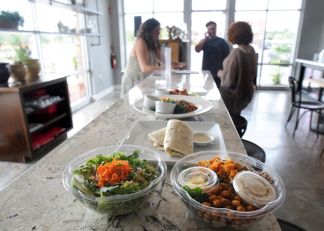 A selection of vegan menu items lines the counter at Root in Monkey Junction. Paul Stephen/StarNews