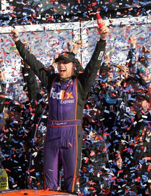 Denny Hamlin stands on his No. 11 Toyota in Gatorade Victory Lane after winning the Daytona 500 earlier this year. NEWS-JOURNAL FILE/DAVID TUCKER