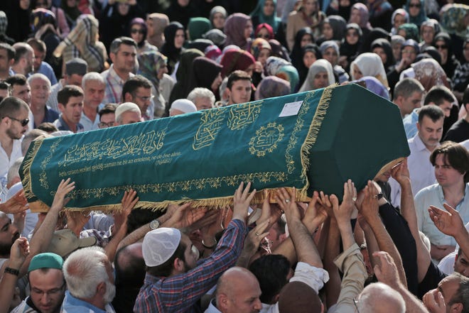 Mourners carry the coffin of Muhammed Eymen Demirci, killed Tuesday at the blasts in Istanbul's Ataturk airport, during the funeral in Istanbul's Basaksehir neighborhood, Wednesday, June 29, 2016. Demirci was 25 years old and worked for ground services at the airport. Suicide attackers killed dozens and wounded scores of others at the busy airport late Tuesday, the latest in a series of bombings to strike Turkey in recent months. Turkish authorities have banned distribution of images relating to the Ataturk airport attack within Turkey. (AP Photo/Lefteris Pitarakis)