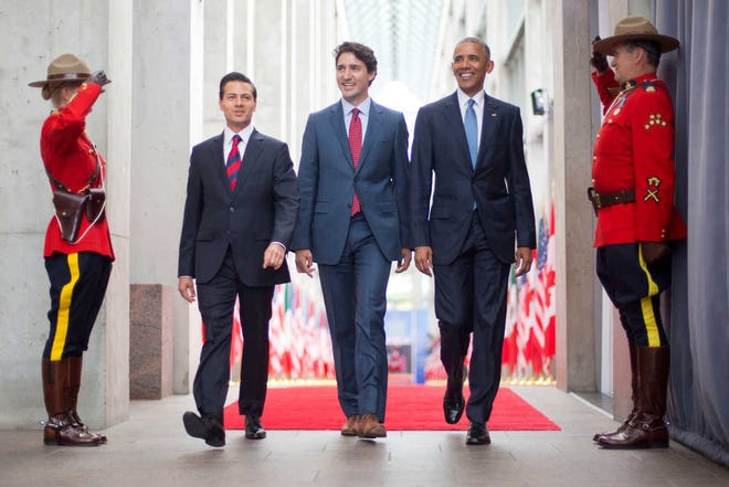 From left, Mexican President Enrique Pena Nieto, Canadian Prime Minister Justin Trudeau and President Barack Obama walk at the National Gallery of Canada on Wednesday in Ottawa, Canada. Obama traveled to Ottawa for the North America Leaders' Summit.