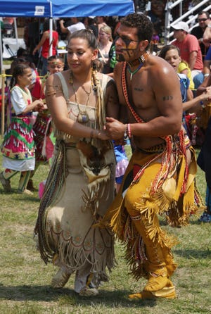 Attaquin Weeden, left, of both the Narragansett and Wampanoag tribes, dances with his partner, Keturah Peters, of the Wampanoag tribe, during a two-step competition at last year's pow wow. STEVE HAINES/CAPE COD TIMES