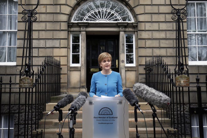 First Minister Nicola Sturgeon speaks to the media outside Bute House, following an emergency Scottish cabinet meeting in Edinburgh, Scotland, Saturday, June 25, 2016. Scottish leader Nicola Sturgeon says Scotland will launch immediate talks with European Union nations and institutions to find a way to remain in the bloc despite Britain's vote to leave. Sturgeon says voters in Scotland gave "emphatic" backing to remaining in the bloc. A majority of voters in more-populous England opted to leave. (Jane Barlow/PA via AP)