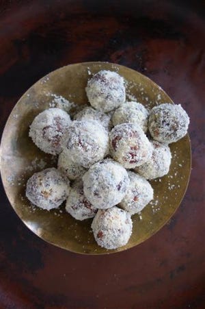 This June 2016 photo provided by Meera Sodha shows natural date and almond balls in London. This recipe by Merra Sodha is a twist on an ancient Indian sweet recipe called khajur pak often found piled high in pyramids in Delhi sweet shops. (Meera Sodha via AP)