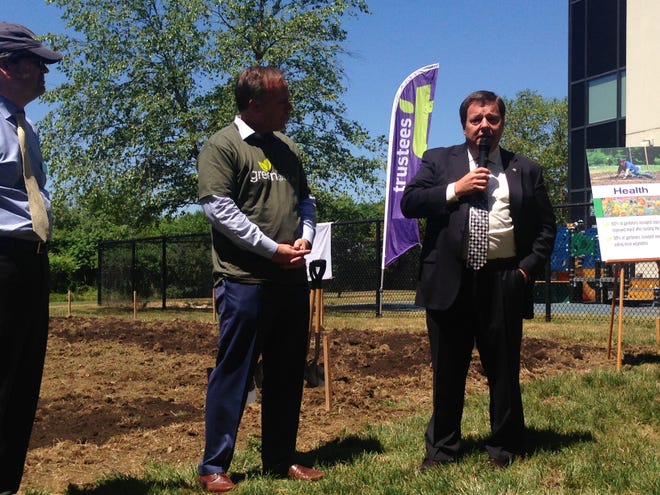 Quincy Mayor Thomas Koch speaks at the Blue Cross Blue Shield garden groundbreaking ceremony Thursday, June 30, 2016. More than 100 employees have committed to tending the garden this summer.