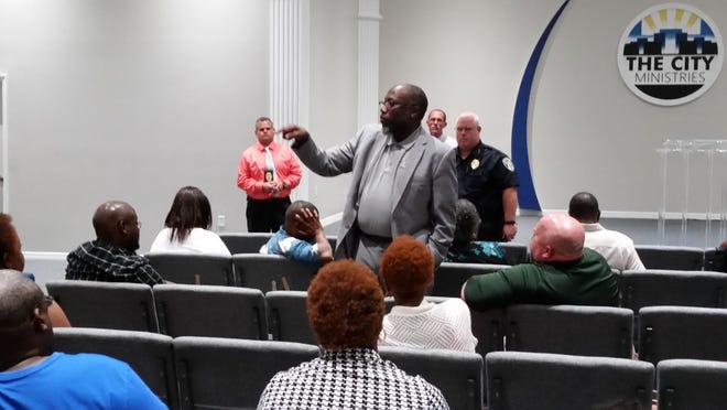 Pastor Christopher Stokes of New Beginning Christian Worship Center addresses the audience at a community meeting Thursday formed to spark tips on a Wildwood shooting from last month.