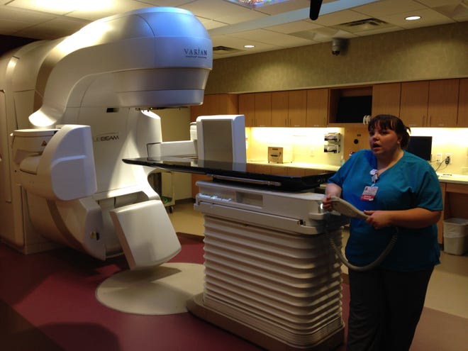 Radiation therapist Jessica MacDonald showcases the new linear accelerator at the Cancer Care Center of York County during an open house there in June. PHOTO BY SHAWN P. SULLIVAN