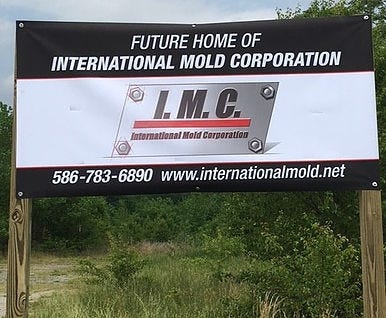 A sign by International Mold of Clinton, Mich., announces the future site of its manufacturing plant near BMW to supply parts for the automaker. The site is behind BMW's Performance Center off Highway 101 in Greer.