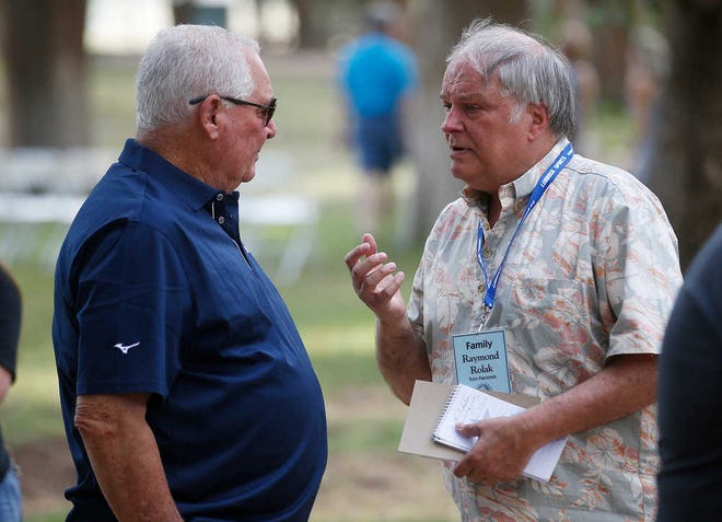 Inductee Augie Garrido, left, talks with Raymond Rolak, right, during the College Baseball Hall of Fame reception Friday, July 1, 2016, at Spirit Ranch in Lubbock, Texas. (Brad Tollefson/A-J Media)