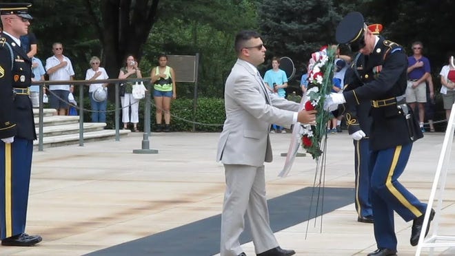 Grand Knight Chris Pereira presents a wreath at the Tomb of the Unknown Soldier at Arlington National Cemetery in Washington, D.C. COURTESY PHOTO