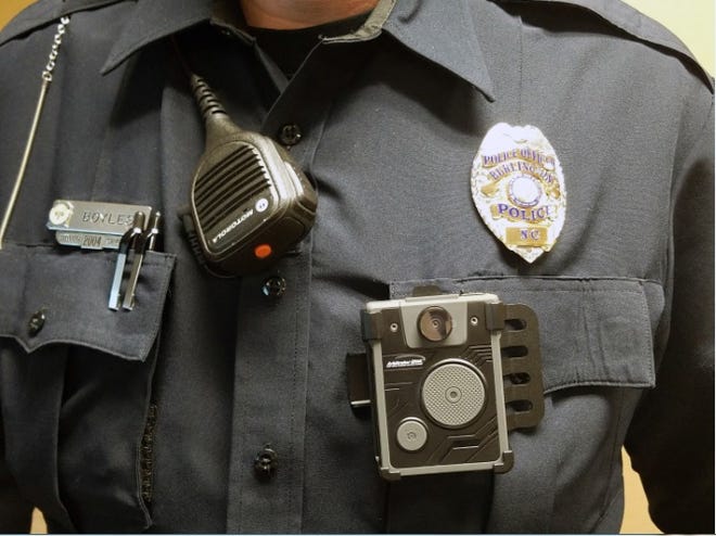 File photo: Burlington officer Jack Boyles wears the chest camera portion of the Panasonic Arbitrator body camera system during a Burlington police training session on the devices.