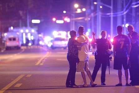 Orlando Police officers direct family members away from the June 12 massacre at Pulse nightclub in Orlando. Two weeks ago, newspapers and other media — including GateHouse Media, The News-Journal's parent company — filed a lawsuit seeking the release of records related to the shooting.  (AP Photo/Phelan M. Ebenhack)