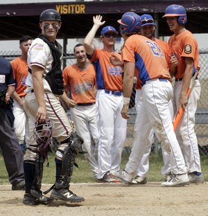 Northborough catcher Ross Grasso (left) reacts as Leominster's Edward Cuddahy (21) crosses the plate on a tripple by Nick Machado to push Leominster ahead 2-1 in Saturday'S Legion game at Memorial field in Northborough.       Daily News and Wicked Local Photo/ Marshall Wolff