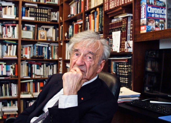 In this Sept. 12, 2012, photo Elie Wiesel is photographed in his office in New York. Wiesel, the Nobel laureate and Holocaust survivor has died. His death was announced Saturday, by Israel's Yad Vashem Holocaust Memorial.