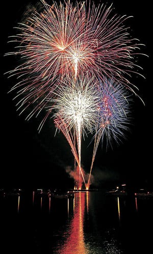 Fireworks light up the sky over the Mississippi River July 4, 2004, in Fort Madison.