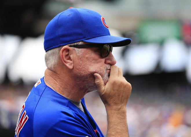 Chicago Cubs manager Joe Maddon watches from the dugout during the second inning of the baseball game against the New York Mets, Sunday, July 3, 2016, in New York. (AP Photo/Seth Wenig)