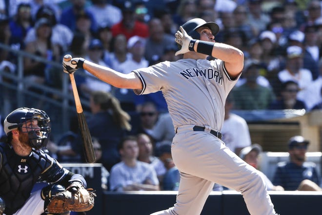 Yankees' Mark Teixeira connects for a home run against the Padres in the eighth inning. It was Teixeira's 400th career home run. The Associated Press