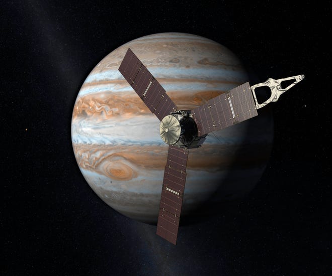 This artist's rendering provided by NASA and JPL-Caltech shows the Juno spacecraft above the planet Jupiter. Five years after its launch from Earth, Juno is scheduled to go into orbit around the gas giant on Monday.