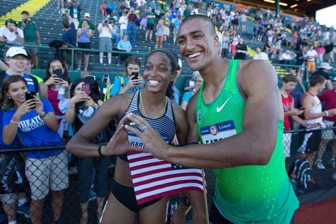 English Gardner and Ashton Eaton celebrate their victories along the track at the 2016 U.S. Olympic Track and Field Trials at Hayward Field in Eugene, Ore., on Sunday, July 3, 2016. (Chris Pietsch/The Register-Guard)