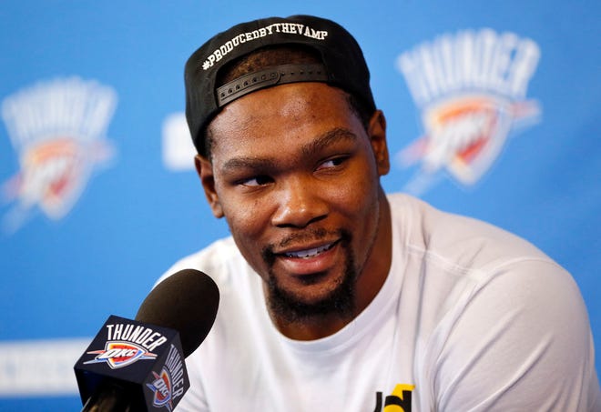 FILE - In a Wednesday, June 1, 2016 file photo, Oklahoma City's Kevin Durant (35) speaks during a news conference at the team's practice facility in Oklahoma City. Durant announced Monday, July 4, 2016 that he is joining All-Stars Stephen Curry and Klay Thompson with the Golden State Warriors. Durant made the decision public on The Players' Tribune Monday morning. He can't officially sign until July 7. (Nate Billings/The Oklahoman via AP, File)