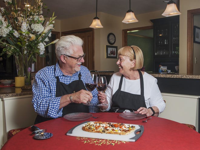 Michael and Rose Porter pair red wine with a Mike's Summer Pizza June 21, 2016, at their home on Pickard Way.
